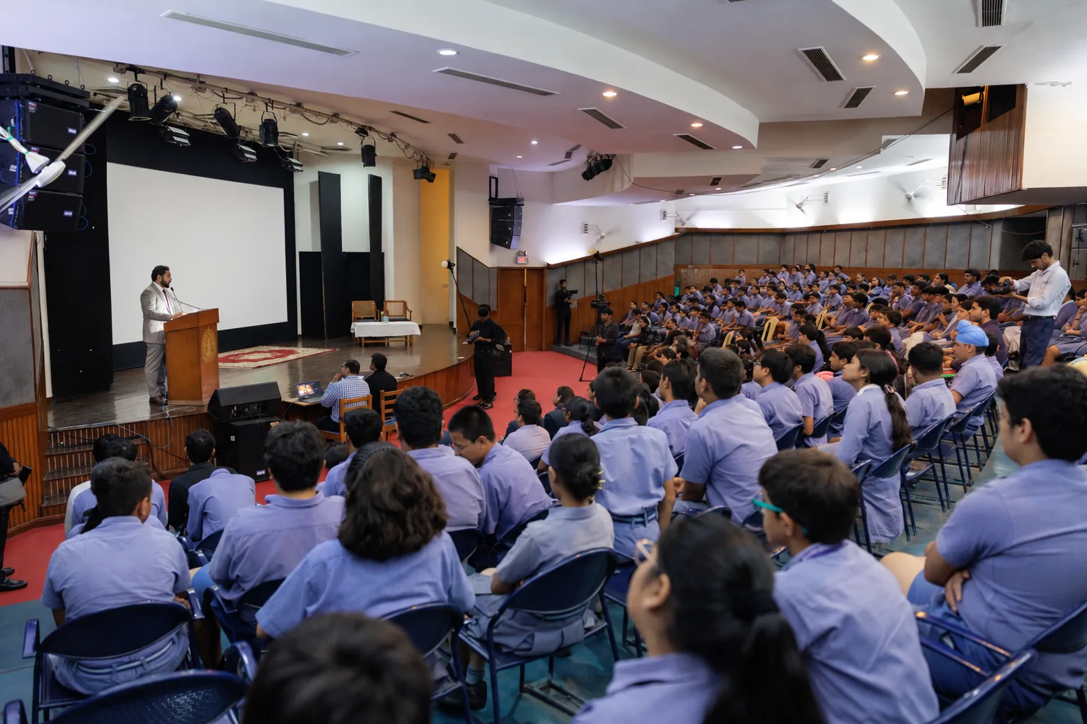 Ashwani Kumar addressing students at a school event