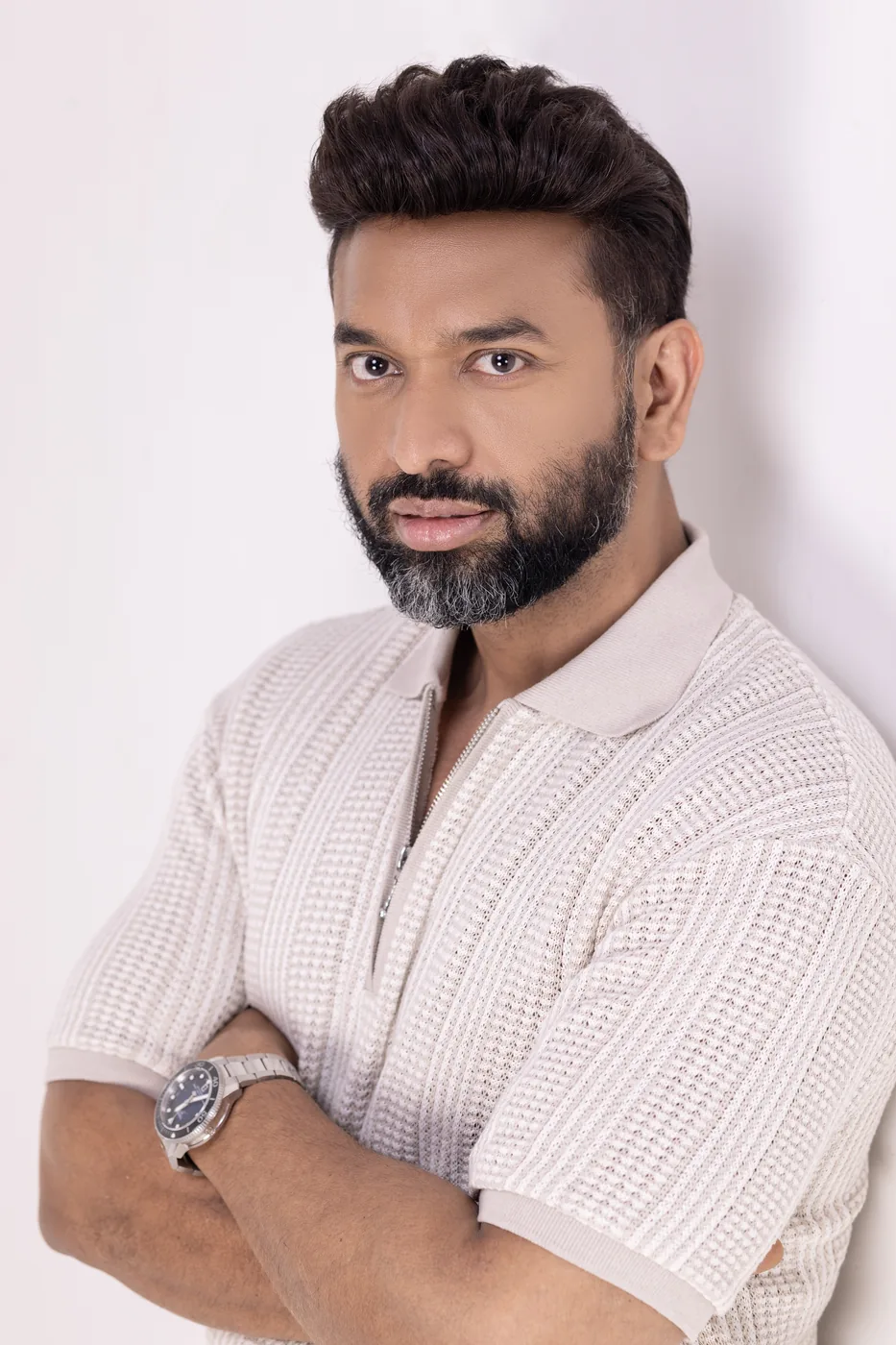 Black and white studio portrait of Ashwani Kumar